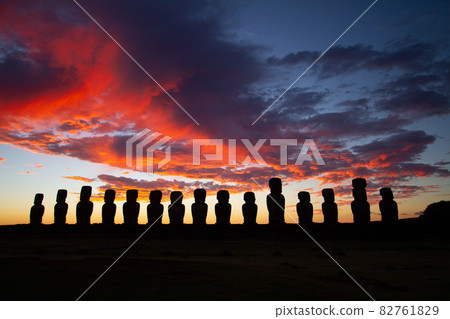 Dramatic colorful sunrise over Moai stone sculptures at Ahu Tongariki, Easter island, Chile. 82761829