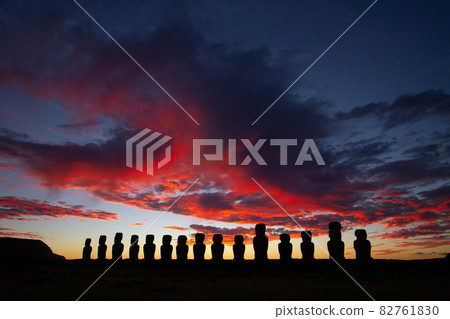 Dramatic colorful sunrise over Moai stone sculptures at Ahu Tongariki, Easter island, Chile. 82761830