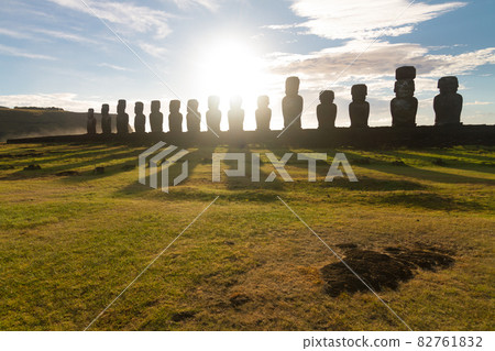 Sunrise over Moai stone sculptures at Ahu Tongariki, Easter island, Chile. 82761832
