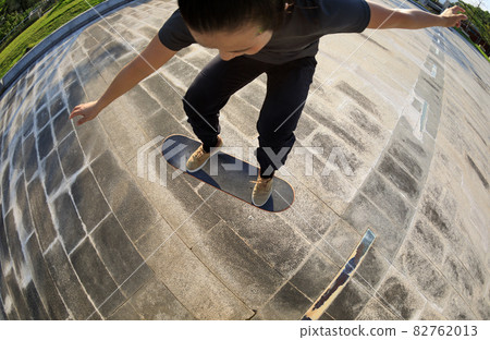 Skateboarder skateboarding outdoors in city Skateboarder skateboarding outdoors in city 82762013
