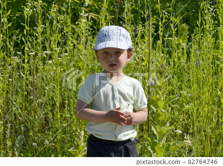 Beautiful baby boy with child face posing photographer Beautiful baby boy with child face posing photographer 82764746
