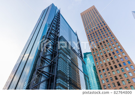 Looking up at the buildings in Shiodome, Tokyo cityscape 82764800