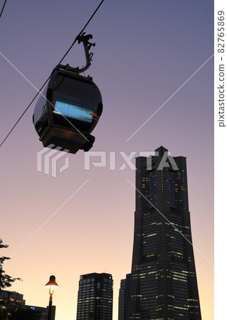 Yokohama Air Cabin (Yokohama Ropeway) and Landmark Tower at dusk 82765869