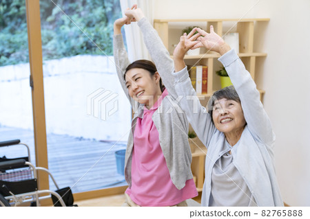 Senior women and caregivers doing recreation Senior women and caregivers doing recreation 82765888