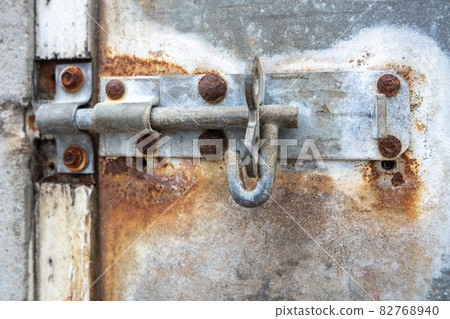 An old rusty metal bar without lock at an harbour 82768940