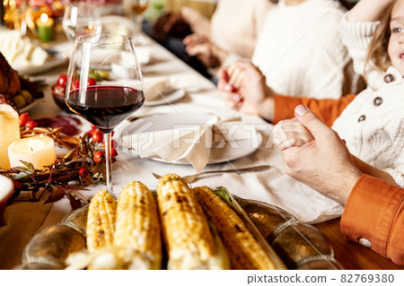 Close-up holiday decorated table for Thanksgiving day with wine and traditional food, dishes. Close-up holiday decorated table for Thanksgiving day with wine and traditional food, dishes. 82769380
