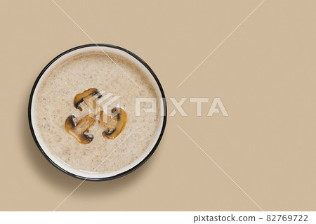 Mushroom champignon cream soup with toast on grey concrete table. View from above. Mushroom champignon cream soup with toast on grey concrete table. View from above. 82769722