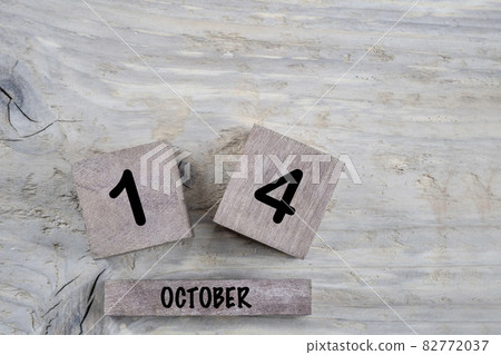 cube calendar for october on wooden background with copy space 82772037