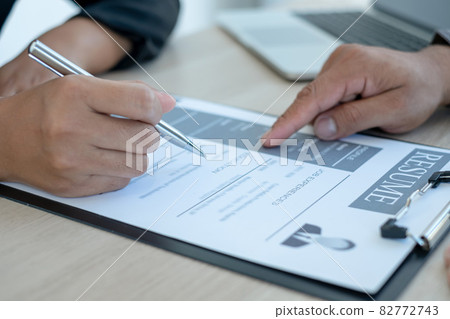 Business people hold a resume and talk to job applicants for job interviews about careers and Her personal history in the company. Recruitment concepts Business people hold a resume and talk to job applicants for job interviews about careers and Her personal history in the company. Recruitment concepts 82772743