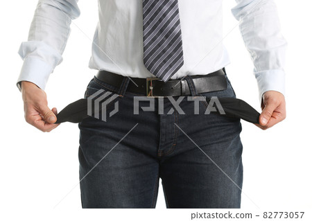 Silhouette of man with empty pockets inside out Silhouette of man with empty pockets inside out 82773057