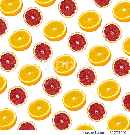 Fresh orange and grapefruit slices seamless pattern over pink background, top view Fresh orange and grapefruit slices seamless pattern over pink background, top view 82775902