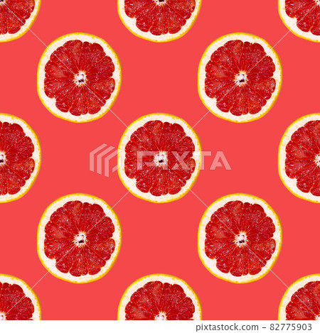 Grapefuit slices seamless pattern over red background, top view Grapefuit slices seamless pattern over red background, top view 82775903