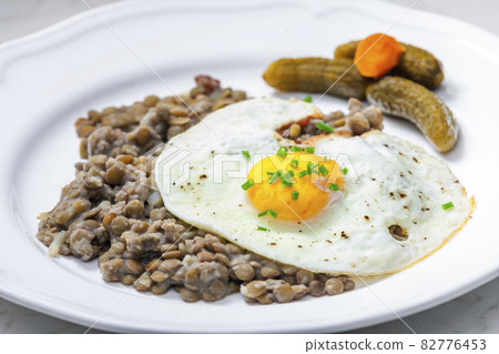 lentils with fried egg and pickled vegetables lentils with fried egg and pickled vegetables 82776453