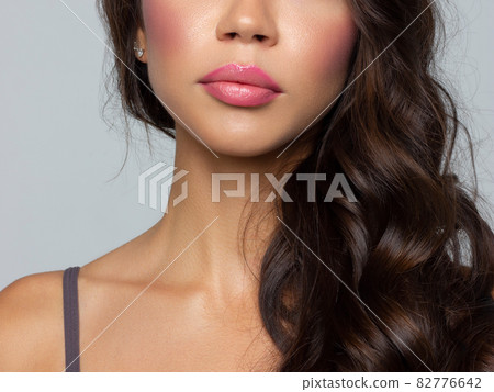 Close-up perfect lip makeup beautiful female mouth. Plump sexy full lips. Macro photo face detail. Perfect clean skin, fresh lip make-up. Sweet pink lipstick, magenta color. Valentine's day style Close-up perfect lip makeup beautiful female mouth. Plump sexy full lips. Macro photo face detail. Perfect clean skin, fresh lip make-up. Sweet pink lipstick, magenta color. Valentine's day style 82776642