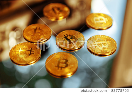 Bitcoins on a mirror background. Crypto fever. Bitcoins on a mirror background. Crypto fever. 82778703