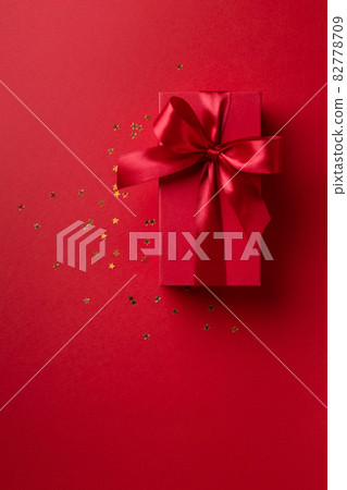 Red gift box on red background. 82778709