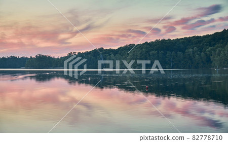 Lake at a peaceful sunset. 82778710