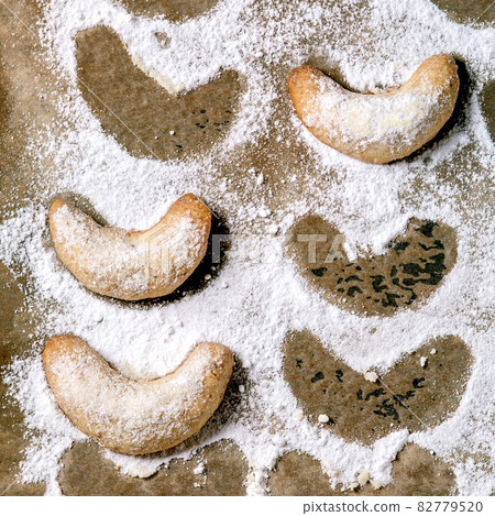 Christmas shortcrust cookies vanilla crescents on baking paper 82779520