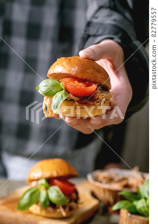 Homemade mini burgers with stew beef in hands 82779557