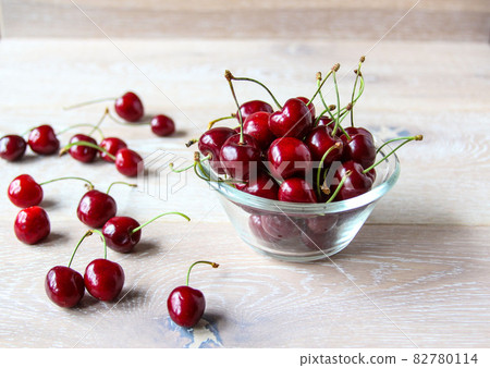 Fresh ripe red berries on a bowl on the rustic background 82780114