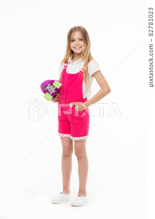 Small girl smile with skate board isolated on white. Child Small girl smile with skate board isolated on white. Child 82781023