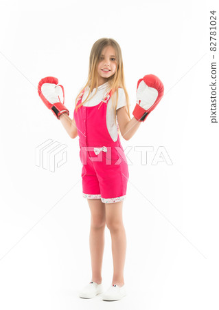 Happy kid in boxing gloves isolated on white. Little girl  82781024