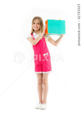 Smart ways to save on clothing. Girl cute teenager carries Smart ways to save on clothing. Girl cute teenager carries 82781025