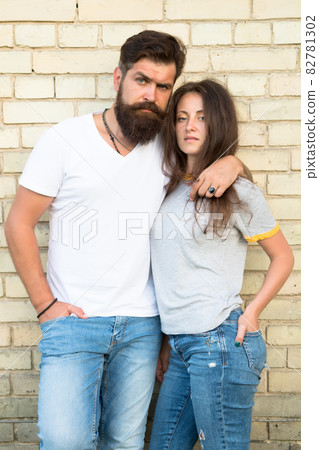 Family couple hugging on brick wall background. Bearded Family couple hugging on brick wall background. Bearded 82781302