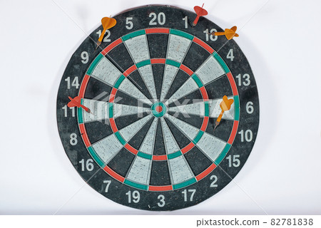 old shabby dartboard with darts on white background old shabby dartboard with darts on white background 82781838