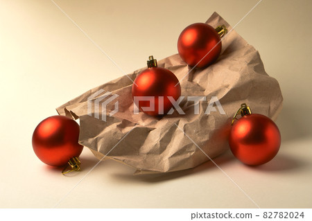 Composition of Red Christmas balls on beige background 82782024