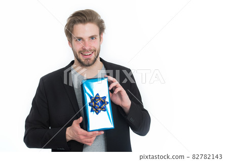 happy handsome man with blue present box 82782143