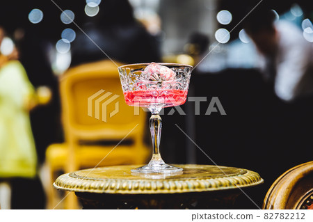 Pink alcoholic cocktail. 82782212