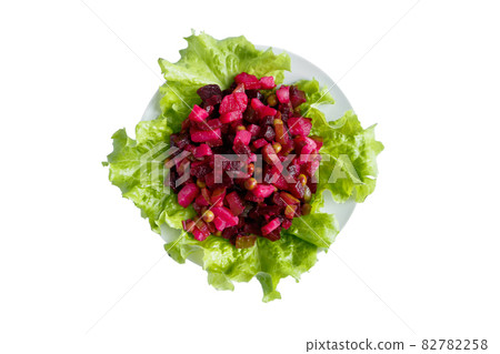 Vinaigrette isolated on a white background. Traditional Russian vegetable salad with red beets on a plate. Vinaigrette isolated on a white background. Traditional Russian vegetable salad with red beets on a plate. 82782258