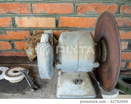 old electric sander on workbench 82782604
