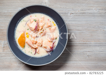 Salmon ceviche on gray wooden table with copyspace 82783225