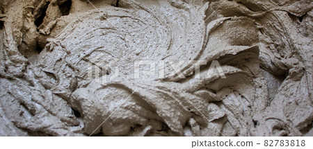 Gypsum plaster in a bucket, prepared for application on the wall. Beautiful texture. 82783818