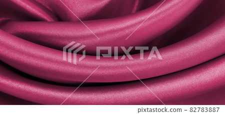 Smooth elegant pink silk or satin luxury cloth texture as abstract background. Luxurious background design Smooth elegant pink silk or satin luxury cloth texture as abstract background. Luxurious background design 82783887