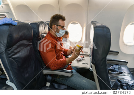 Adult male sitting and looking on cup of hot drink Adult male sitting and looking on cup of hot drink 82784173