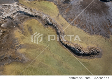 Drone view of the turquoise lake formed as a result of mining waste 82785333