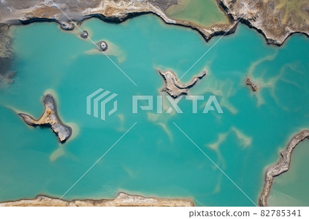 Drone view of the turquoise lake formed as a result of mining waste 82785341