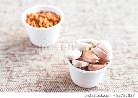 caramelized onion and garlic set cooking on a light background caramelized onion and garlic set cooking on a light background 82785837