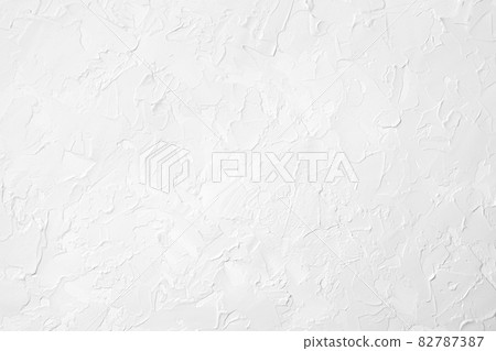 White wall background texture with uneven surface 82787387
