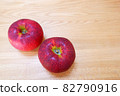 Two apples on the grain of wood (cultivar Akiei) 82790916
