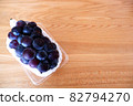 Grape Pione in a pack with wood grain background copy space 82794270