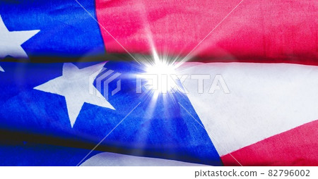 Bright spot of light against american flag 82796002