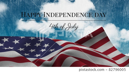 Happy independence day text and waving american flag against clouds in blue sky 82796005