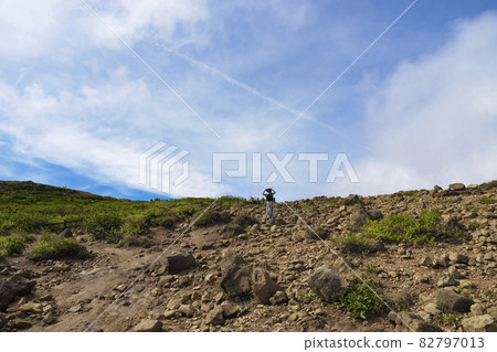A woman sightseeing in Zao's Okama 82797013