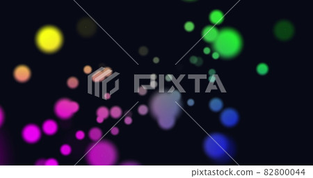 Image of multi coloured glowing spots of light moving in hypnotic motion on black background Image of multi coloured glowing spots of light moving in hypnotic motion on black background 82800044