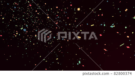 Multicoloured pieces of confetti falling seamlessly on a black background Multicoloured pieces of confetti falling seamlessly on a black background 82800374