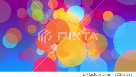 Multicoloured circles moving and multiplying to fill a graduated blue background 82801182